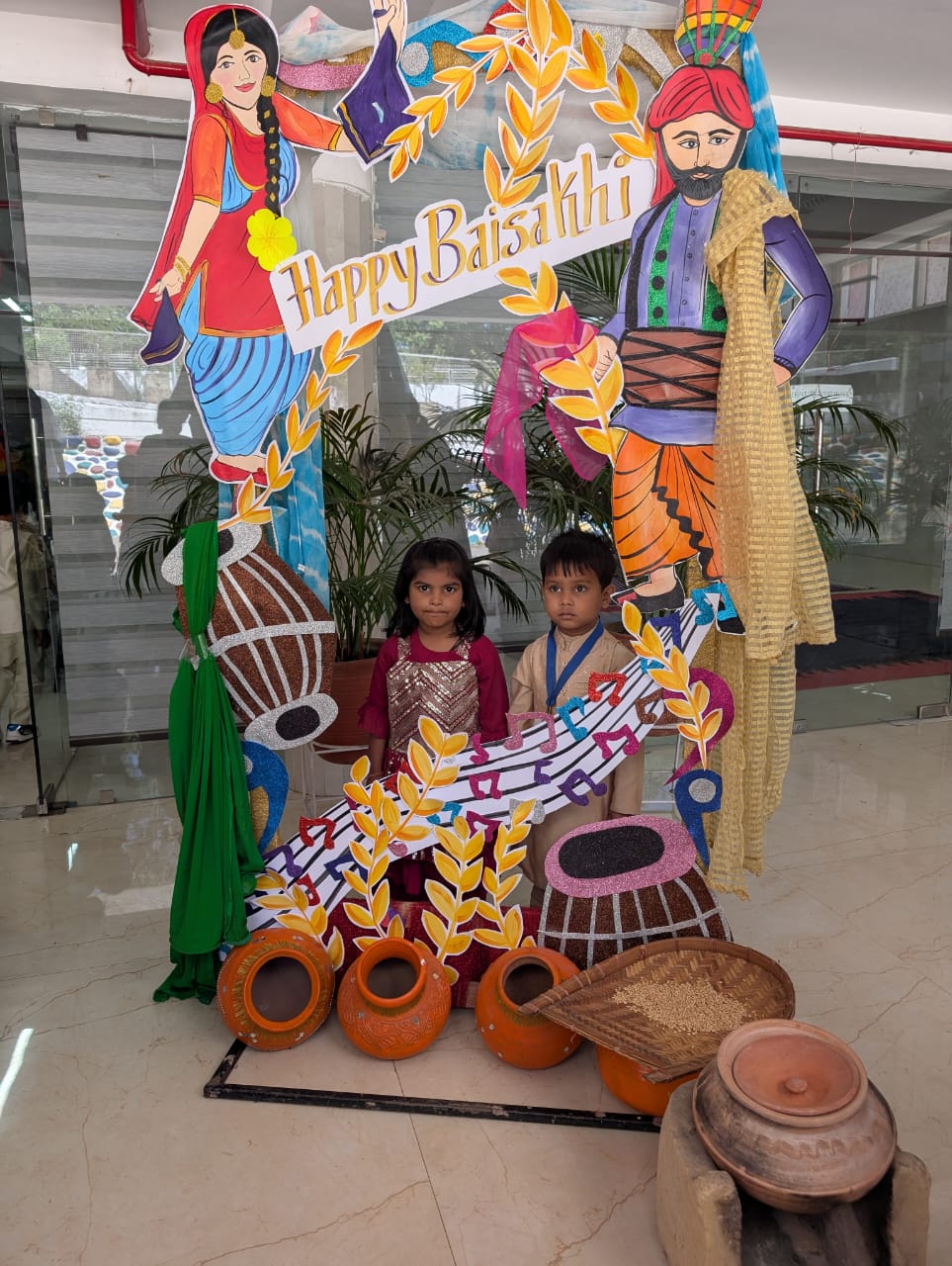 Kids posing by the Baisakhi standee